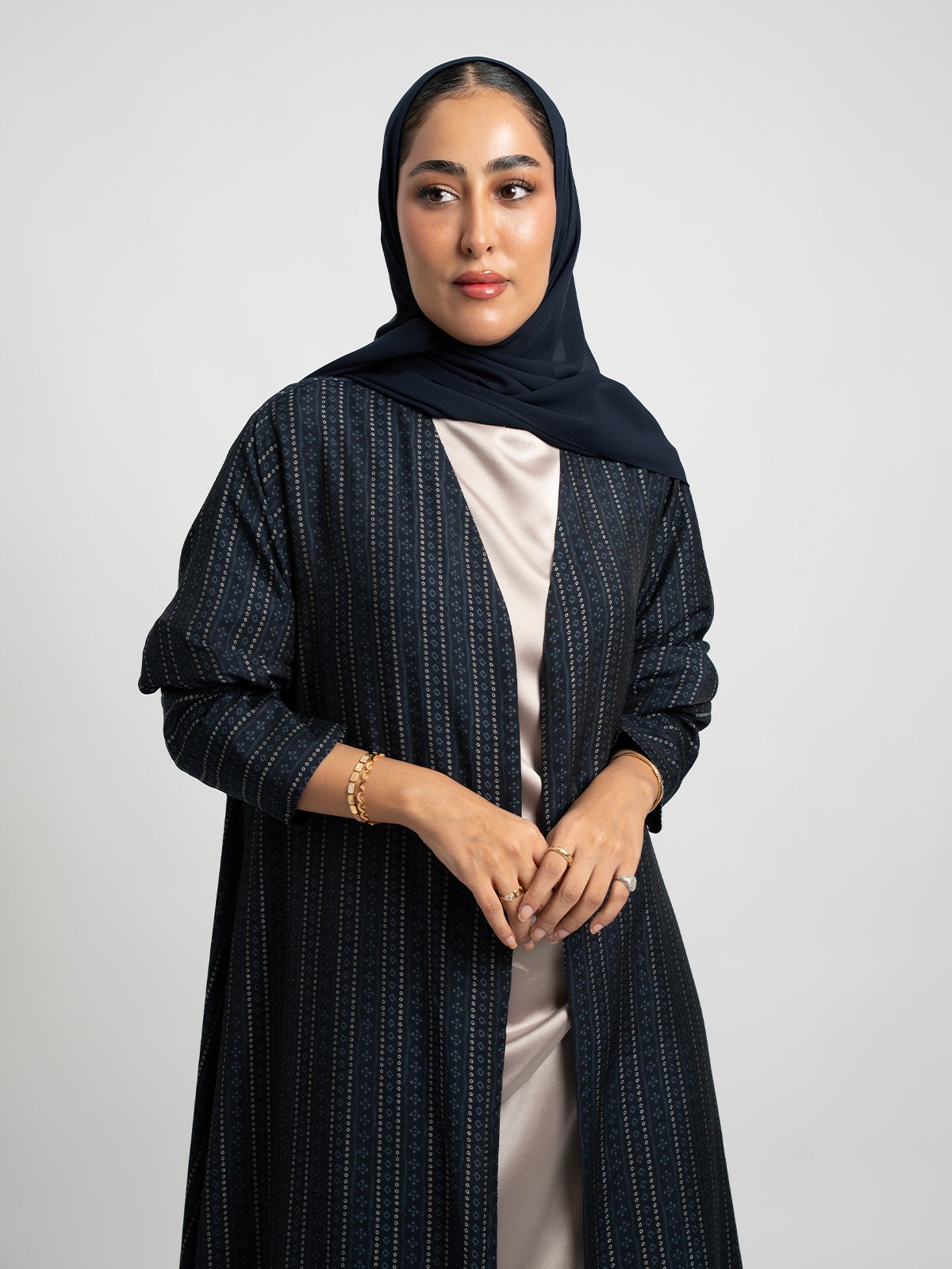 28020fw261sacon-navy-midnight-orbit-a-cut-abaya-half-cloch-a-cut-long-open-abaya-with-tight-sleeves-in-printed-modal-fabric-1-base_1.jpg عباية نص كلوش أوج الليل كحلي - الصورة 1